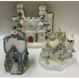 A group of three Staffordshire houses. Est. £20 -