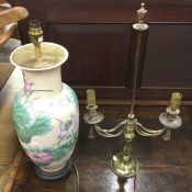 A tall pottery floral decorated vase converted to