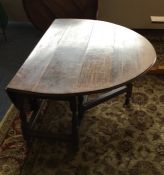 A Georgian oak hinged top drop leaf table. Est. £5