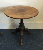 A Georgian mahogany tilt top table on three spread