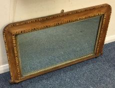 A large parquetry mounted mirror with inlaid decor