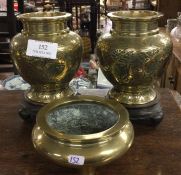 A good pair of Chinese brass mounted vases on wooden s