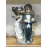 A Lladro figure of a young dancing couple. Est. £1