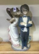 A Lladro figure of a young dancing couple. Est. £1