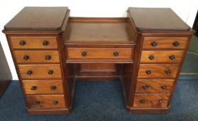 A mahogany twin pedestal desk of shaped form. Est.