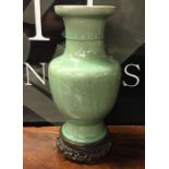 A Chinese celadon pottery vase decorated with flow