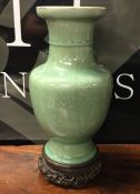 A Chinese celadon pottery vase decorated with flow