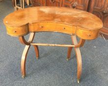 An unusual 20th Century kidney shaped desk with st