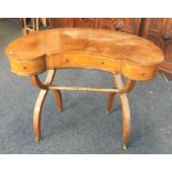 An unusual 20th Century kidney shaped desk with st