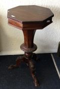 A Victorian mahogany sewing table on three sweepin