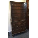 A reproduction mahogany veneered chest on chest. E