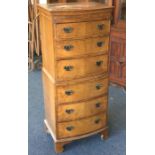 A reproduction six drawer chest-on-chest. Est. £30
