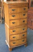 A reproduction six drawer chest-on-chest. Est. £30