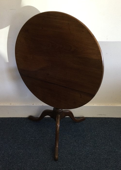 An early Georgian oak table of circular form with