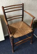 An Antique slat back chair with cane seat. Est. £2