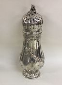 A Continental silver sugar caster of baluster form