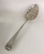 A George III silver berry spoon. London. By Eley &