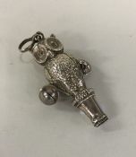 A small child's rattle in the form of an owl with