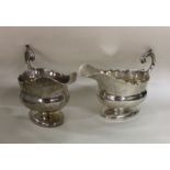 A good pair of crested silver sauce boats with car