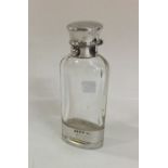 A good glass and silver mounted scent bottle / vin