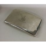 A large shaped silver cigarette case with crested