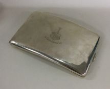 A large shaped silver cigarette case with crested