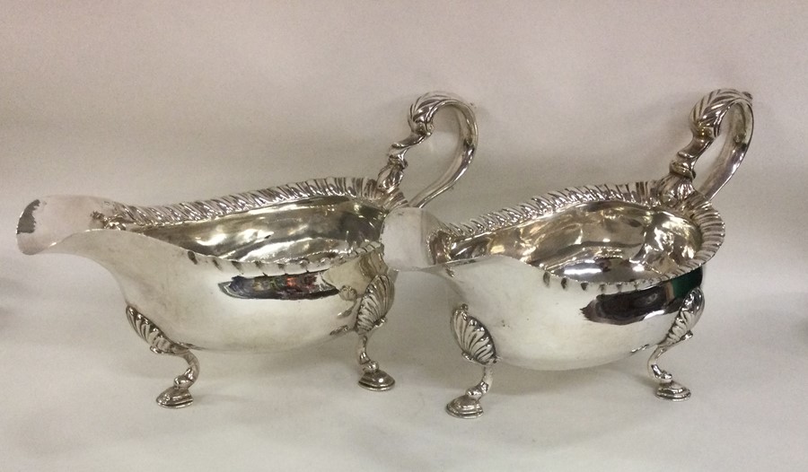 A pair of heavy Georgian silver sauce boats with g