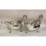 A pair of heavy Georgian silver sauce boats with g