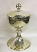 A large silver gilt church chalice with hammered b