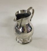 A heavy Georgian silver sparrow beak cream jug of