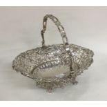 An attractive Georgian silver bonbon dish on scrol