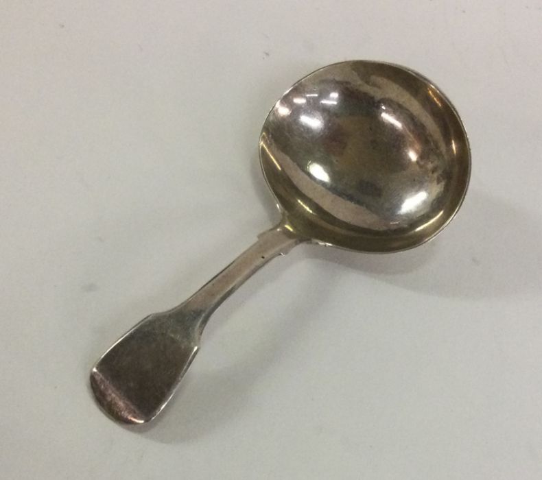 A Georgian silver fiddle pattern caddy spoon of pl