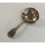 A Georgian silver fiddle pattern caddy spoon of pl