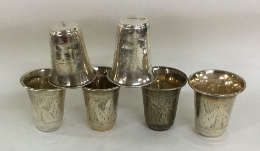 A good set of six silver spirit tots with engraved