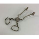 A pair of Georgian silver sugar scissors of typica