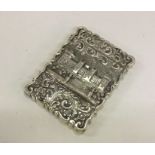A rare cast silver castle top card case depicting