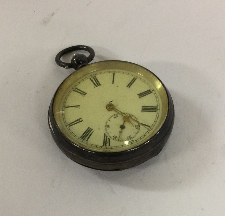 A silver pocket watch with white enamelled dial. E