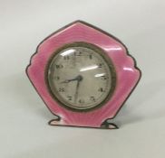 A stylish silver and pink enamelled clock. Birming