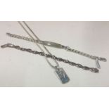 A silver curb link bracelet together with a neckla