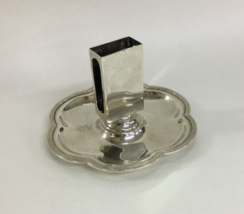 A heavy circular silver match holder on stand. Bir