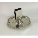 A heavy circular silver match holder on stand. Bir