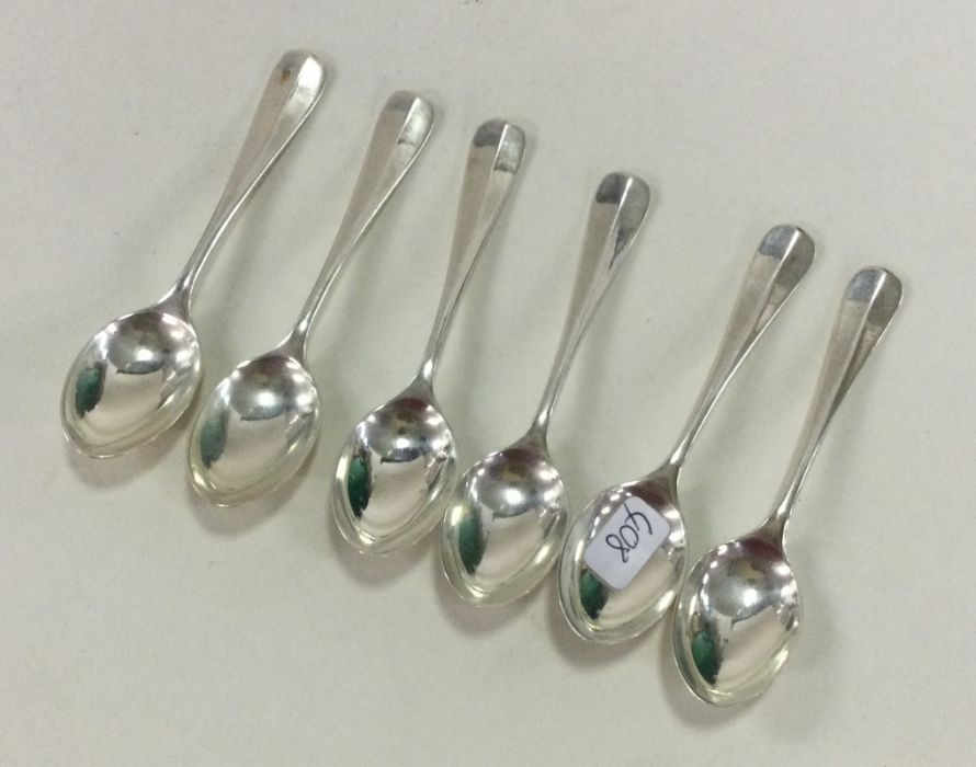 A set of six silver coffee spoons. London. By JMC.