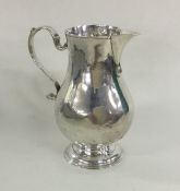 A Georgian silver sparrow beak pitcher cream jug o