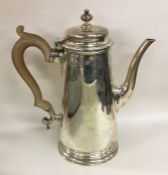 A Georgian style tapering silver coffee pot. Londo