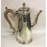 A Georgian style tapering silver coffee pot. Londo