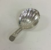 A George III silver caddy spoon with bright cut de