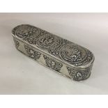 A heavy oval Dutch silver box depicting figures to