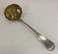 A good cast silver berry ladle engraved with flowe