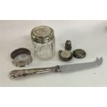 A silver mounted sovereign case, cheese knife etc.