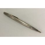 A heavy engine turned silver pencil of typical for